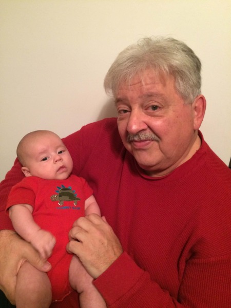 grandfather holding baby